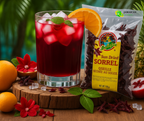 Caribbean Delight Sun Dried Sorrel beside a refreshing glass of red hibiscus drink garnished with orange slice and mint, surrounded by tropical fruits and flowers, showcasing authentic Jamaican flavor for Canadian shoppers.